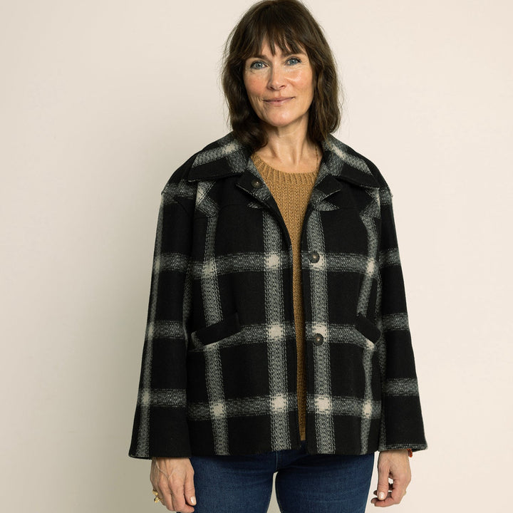 Car Coat Sewing Pattern displayed on a model wearing a stylish black and white checked coat