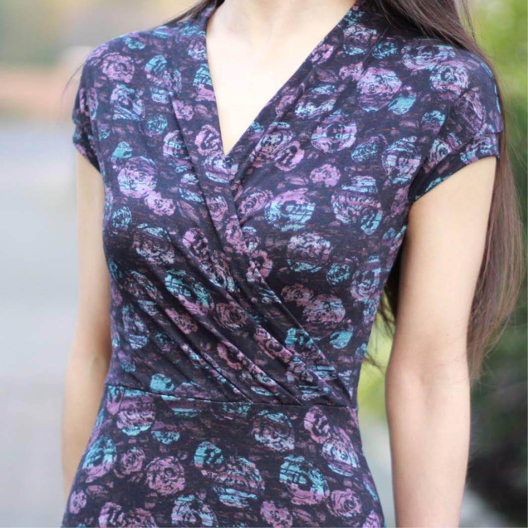 Mirri dress how to fold the pleats on the front neckline displayed with a close-up on the patterned fabric.