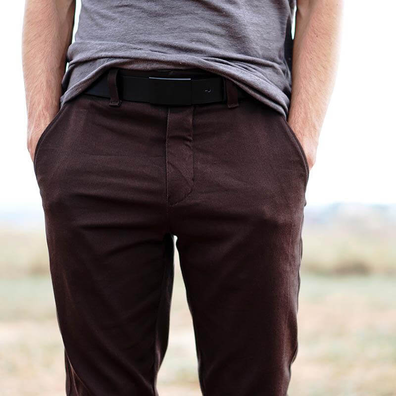 Installing a zipper tutorial showing a close-up of brown pants with a fly.