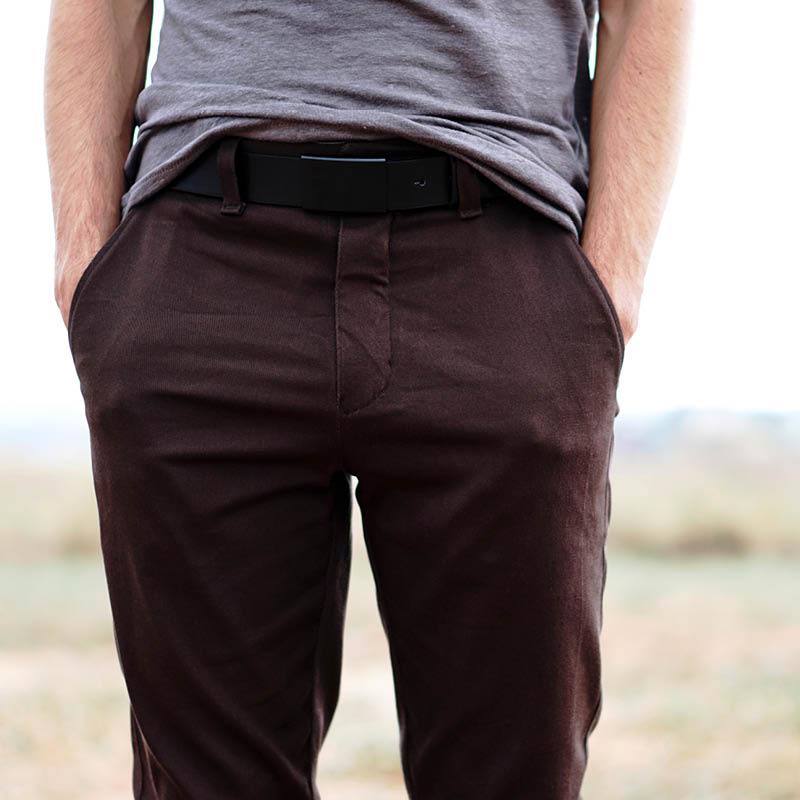 Installing a zipper tutorial showing a close-up of brown pants with a fly.