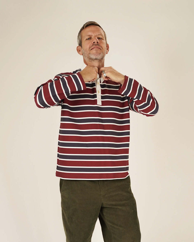 Model wearing Rugby Polo Shirt sewing pattern, striped jersey with three-button placket, relaxed fit.