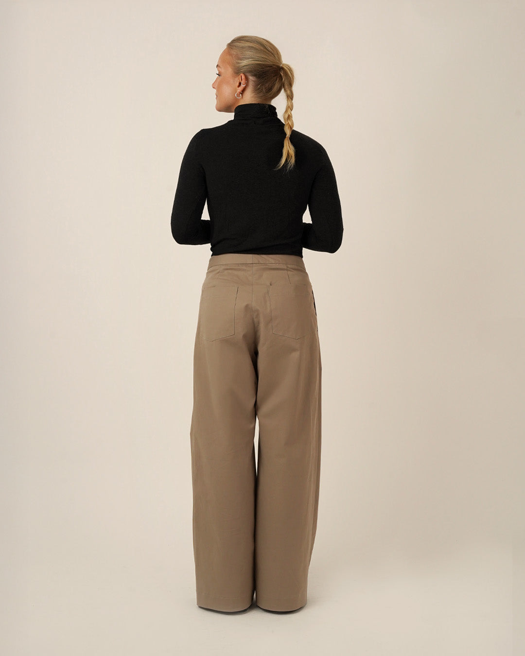 Bermuda Pants and Shorts Sewing Pattern displayed on a model from the back, showcasing a relaxed fit and deep side pockets.