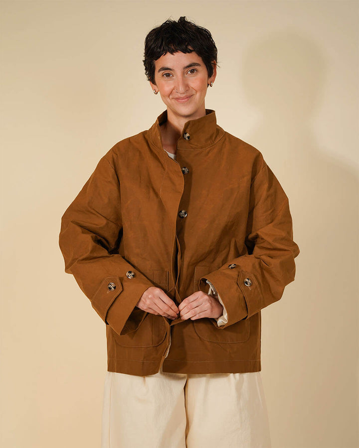 Wardrobe By Me Funnel Neck Jacket sewing pattern with a high collar and relaxed fit in rich brown color.