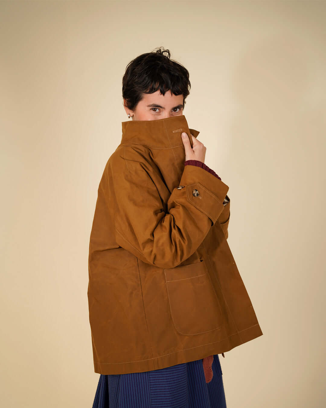 Funnel Neck Jacket Sewing Pattern featuring a model in a brown jacket with a funnel neck and relaxed silhouette.