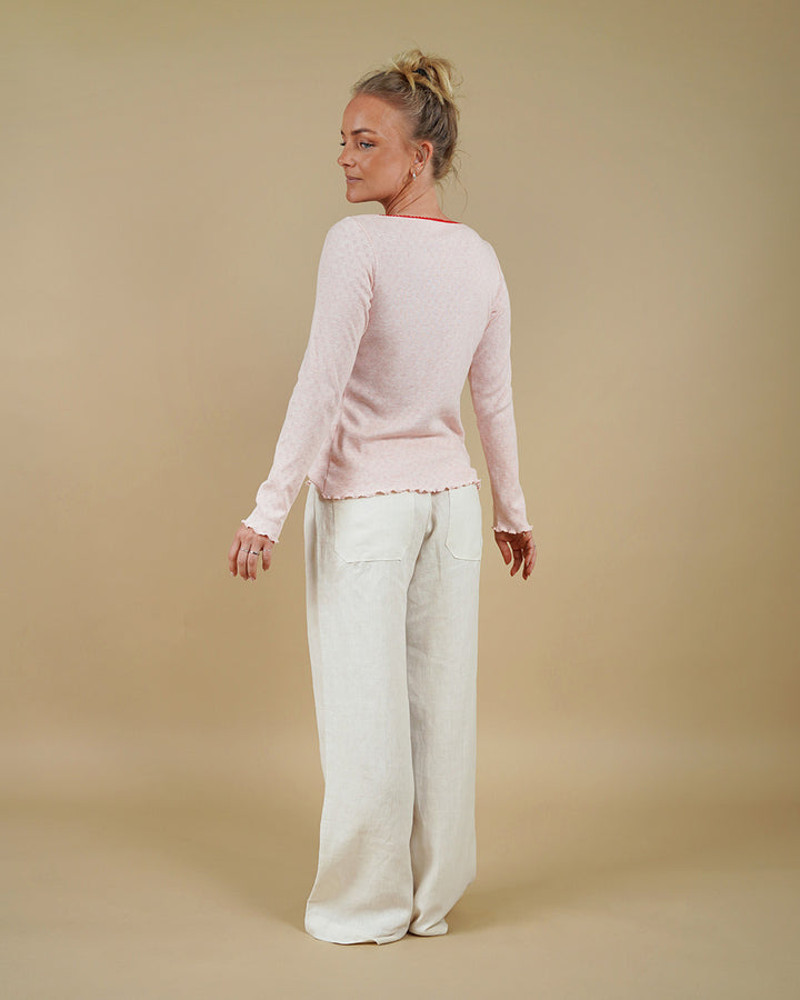 Woman wearing the Camisole Top and High Waist Pants sewing pattern, back three-quarter view