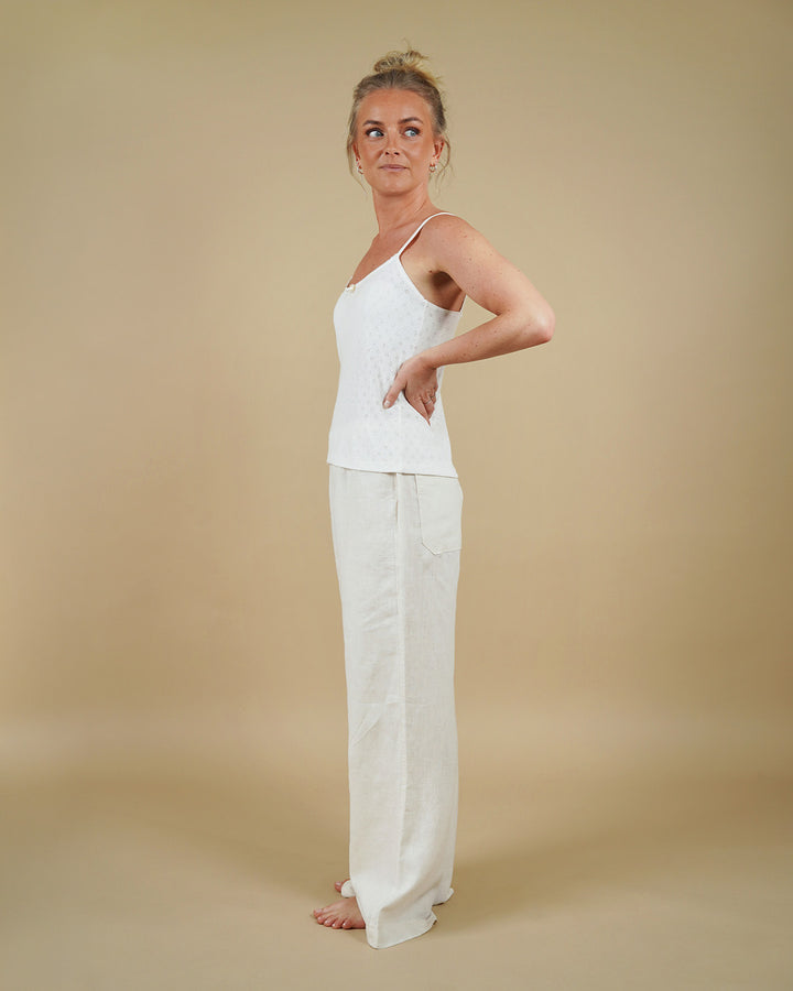 Woman wearing the Camisole Top and High Waist Pants sewing pattern, side view