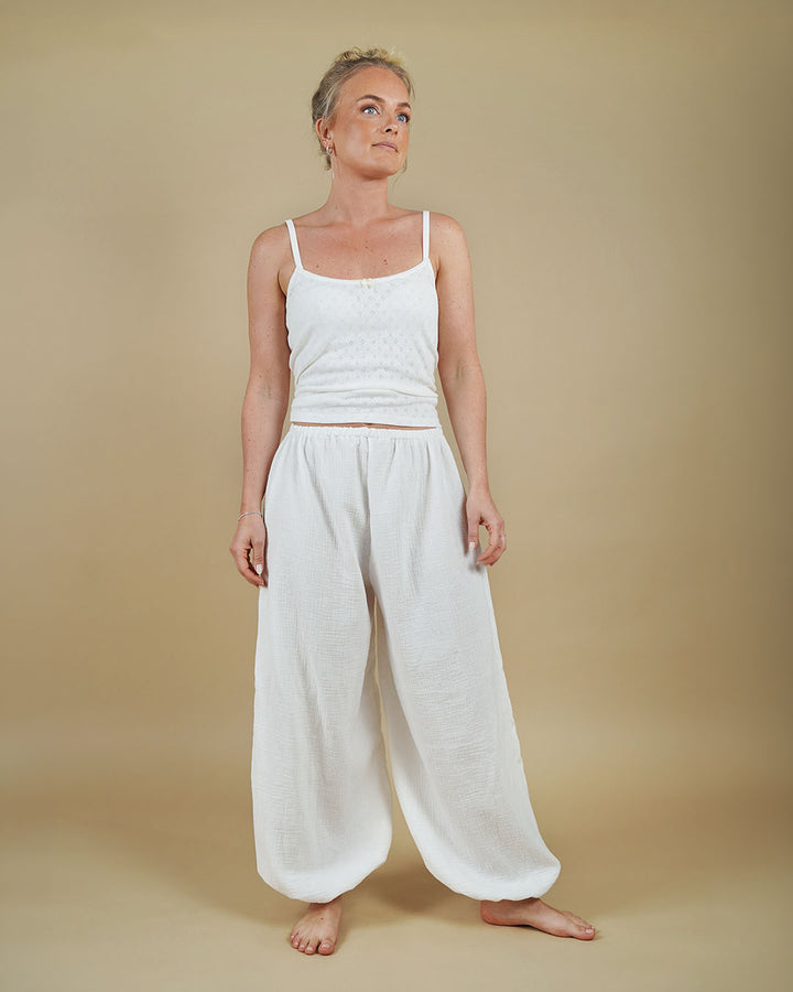 Woman wearing the Carma Camisole and Bubble Pants sewing pattern in white, front view
