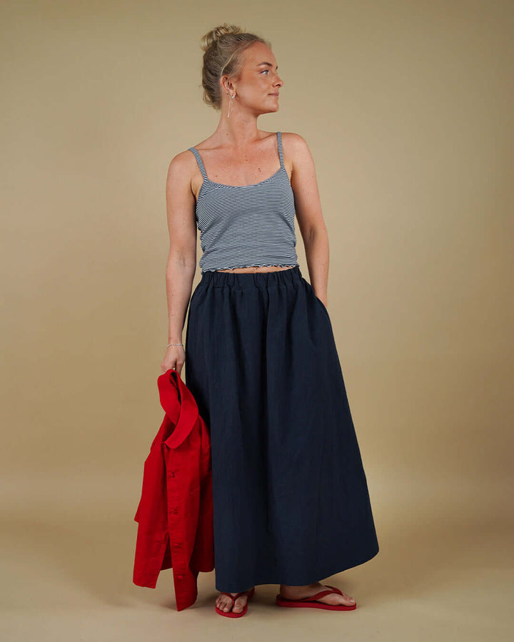 Woman wearing the Claude Skirt and Camisole Top sewing pattern, front three-quarter view