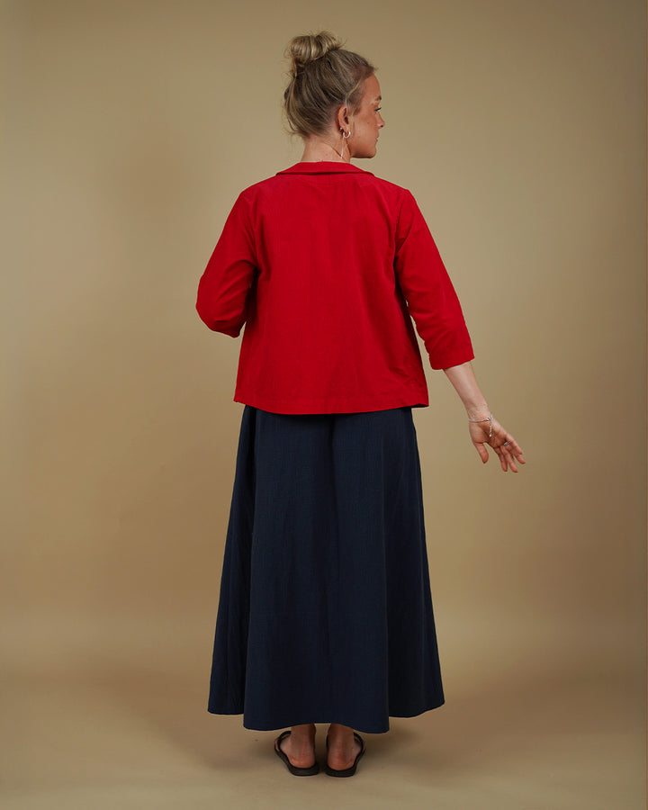 Woman wearing the Dukke Blouse and Claude Skirt sewing pattern, back view