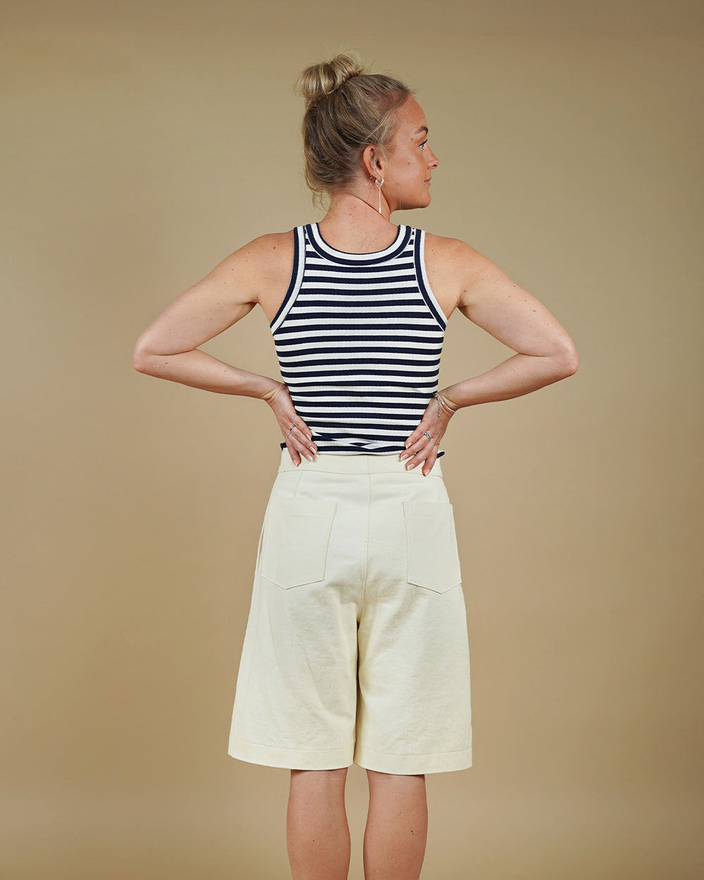 Woman wearing the Muscle Tank and Bermuda Shorts sewing pattern, back view
