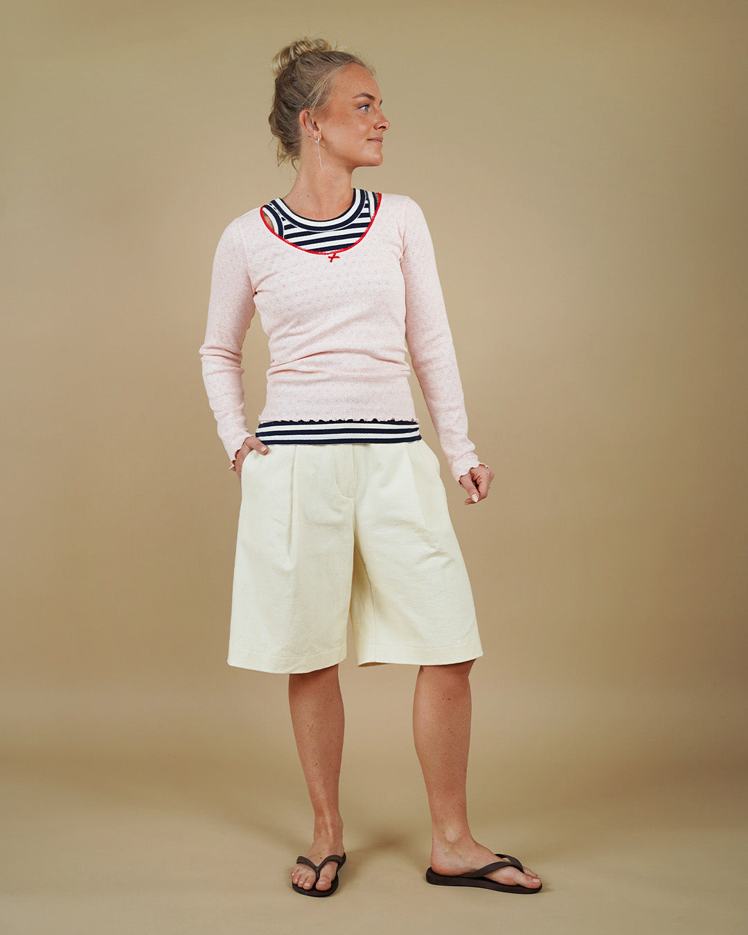 Woman wearing the Muscle Tank, Camisole Top and Bermuda Shorts sewing pattern, front three-quarter view