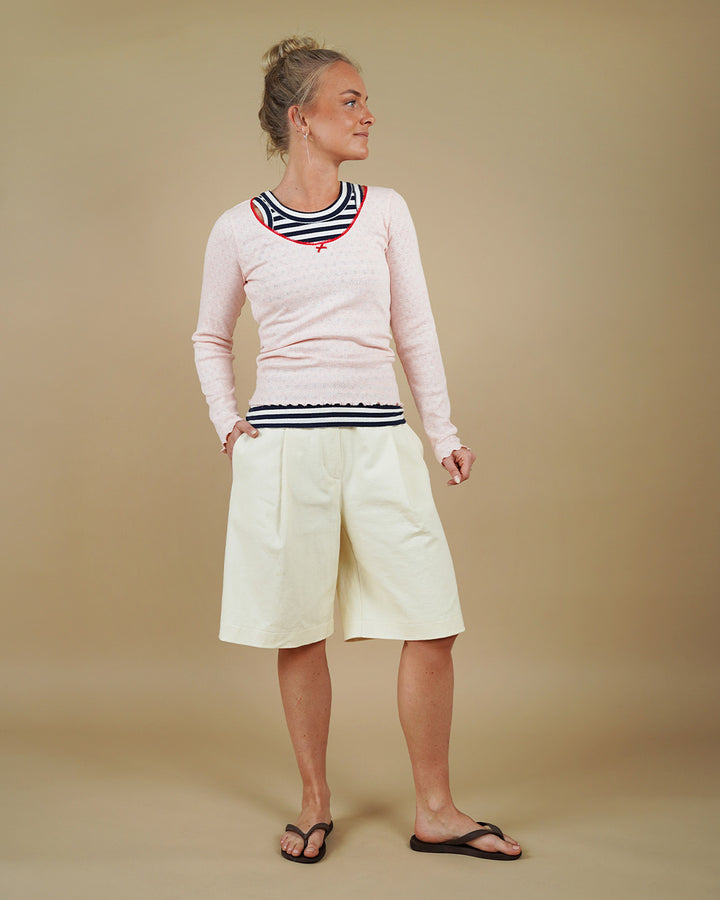 Woman wearing the Muscle Tank, Camisole Top and Bermuda Shorts sewing pattern, front three-quarter view