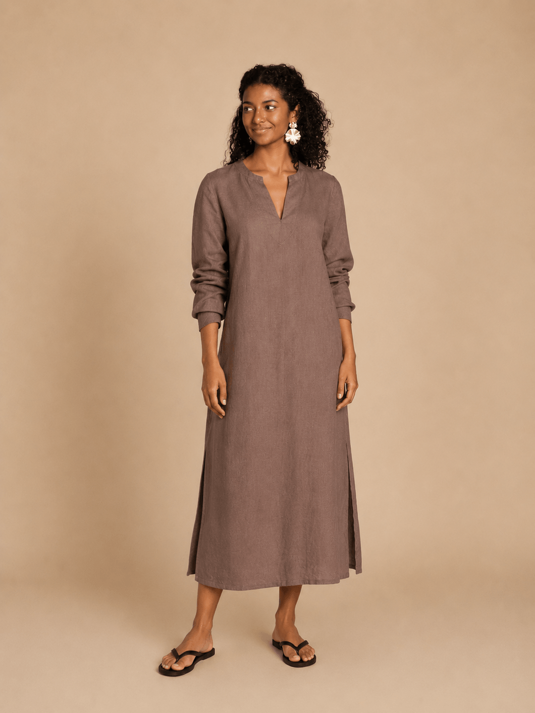 A model wearing a brown Piper Tunic Sewing Pattern, featuring long sleeves and a simple neckline.