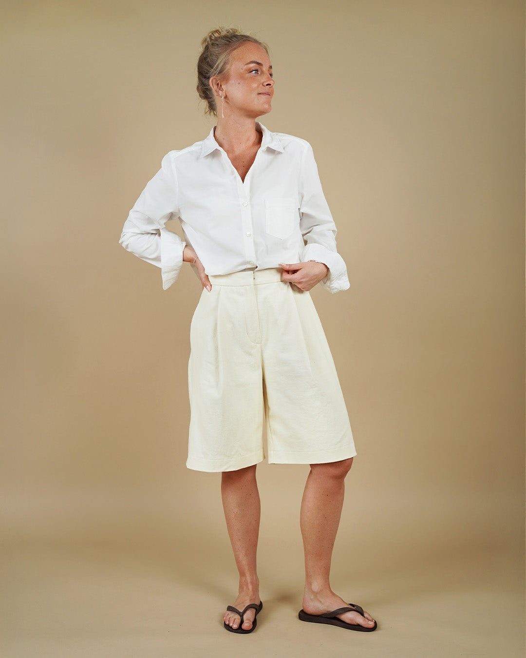 Woman wearing the Shirt and Bermuda Shorts sewing pattern, front three-quarter view