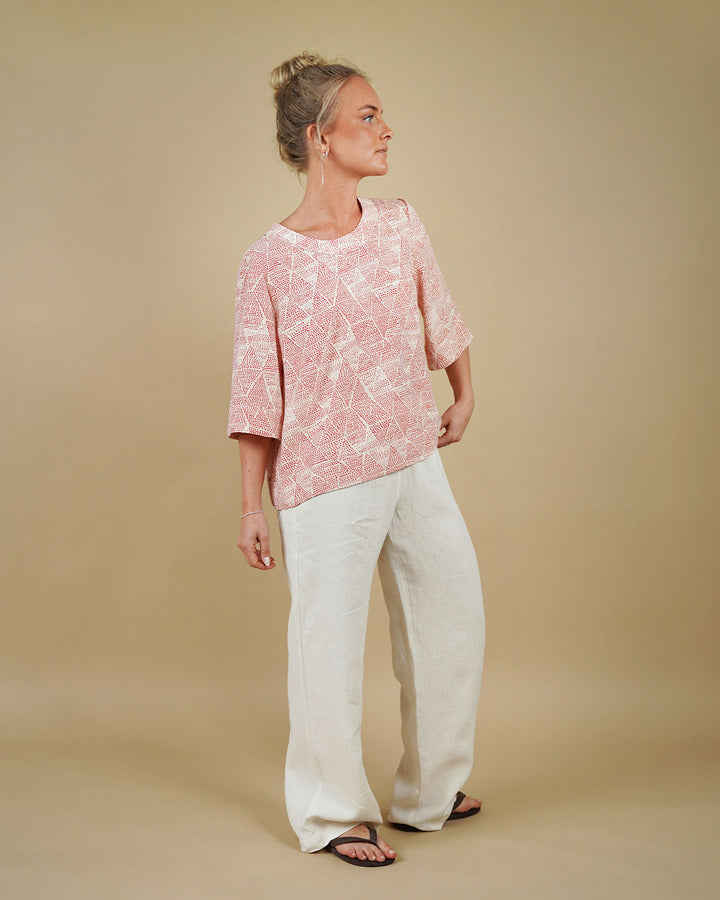 Woman wearing the Silke Blouse and High Waist Pants sewing pattern, front view