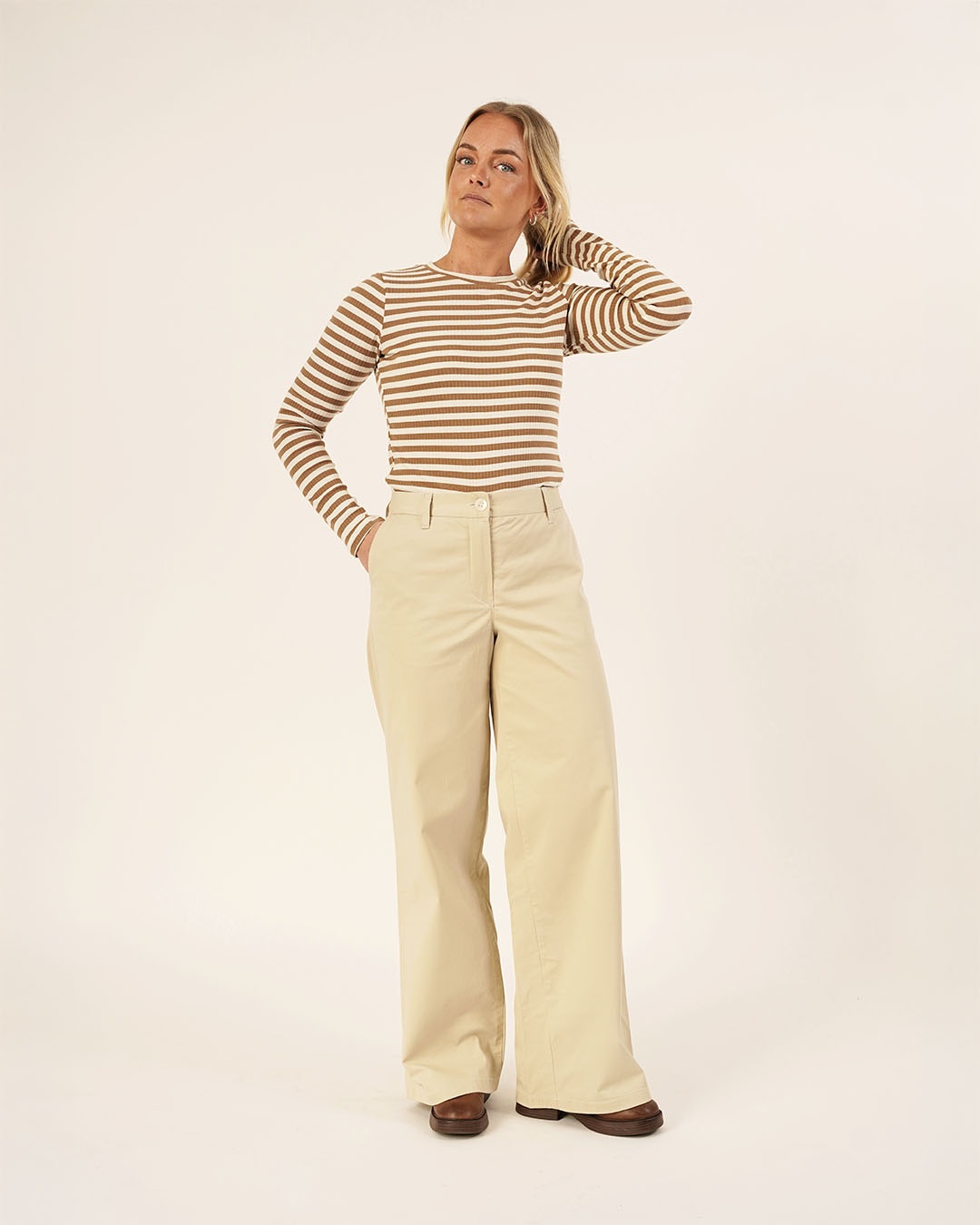 Woman wearing the Wardrobe Builder T-shirt and Hepburn Pants sewing pattern, front view