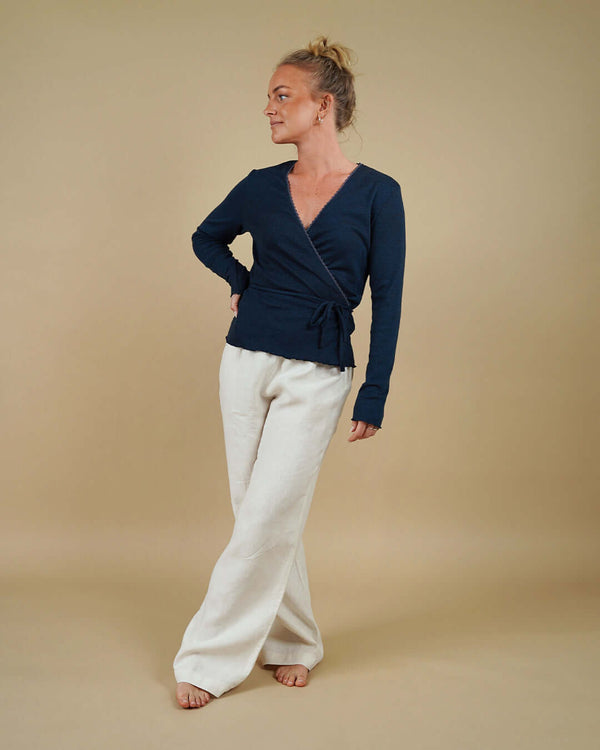 Woman wearing the Wrap Blouse and High Waist Pants sewing pattern, front view